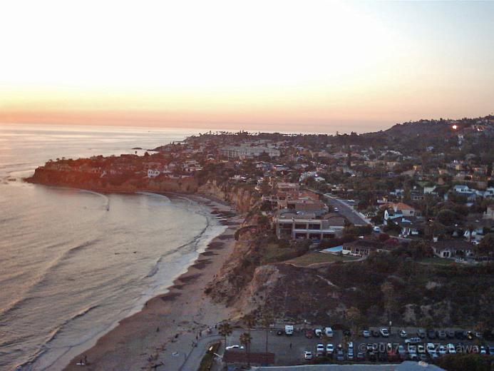 IMG_0198.jpg - The sun is setting over the Pacific, the parking lot for Historic Tourmaline Beach in the foreground.